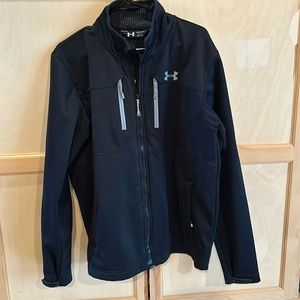 Under Armour lightweight black jacket. Worn a few times.  100% polyester. Mens L